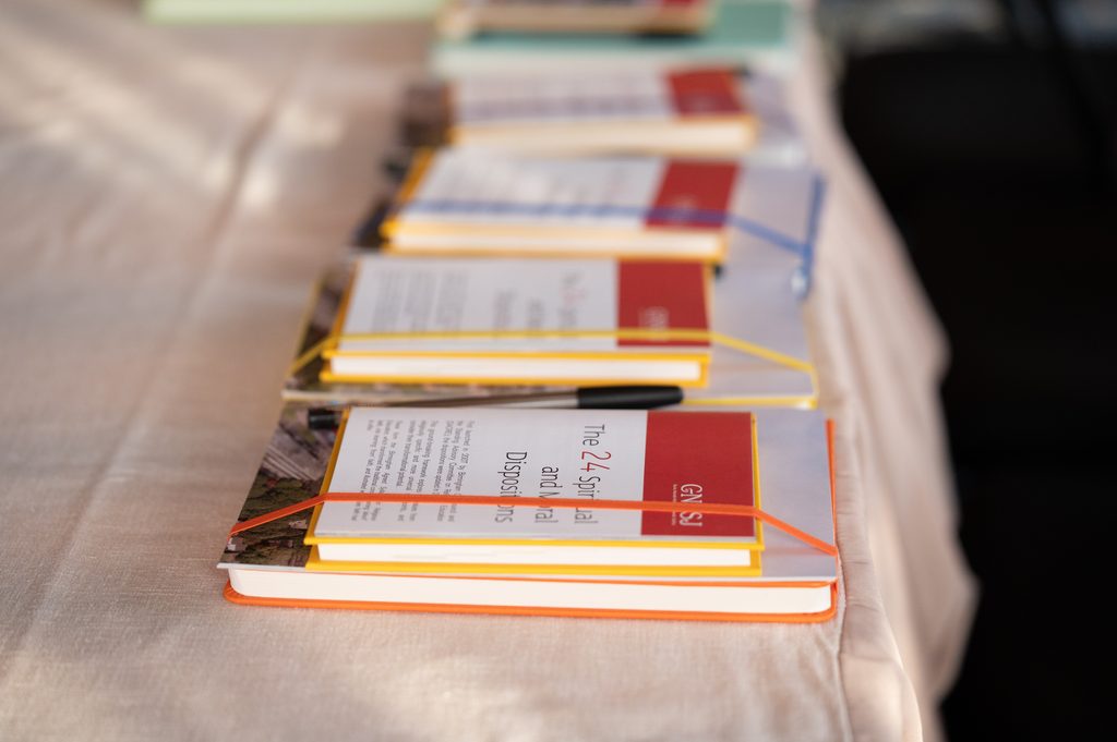 Resource packs laid out on a table for retreat participants