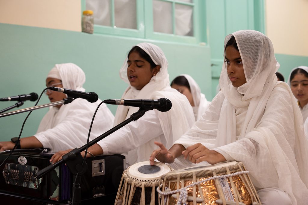 Students reciting kirtan